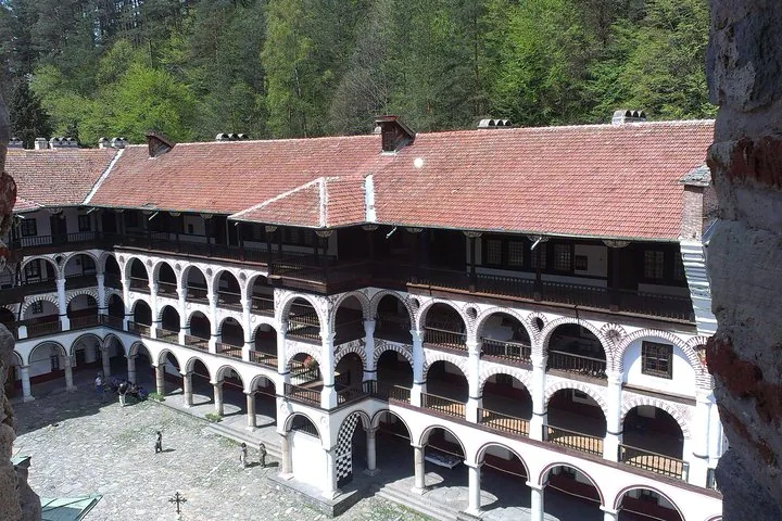 Elevated view showing the multi-story residential wings and courtyard of Rila Monastery